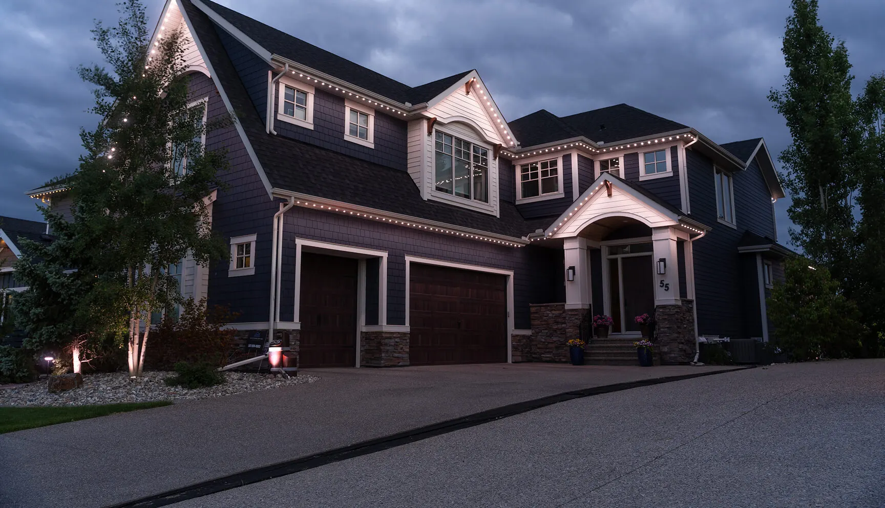 Pointer Light installed and lit on a home at night
